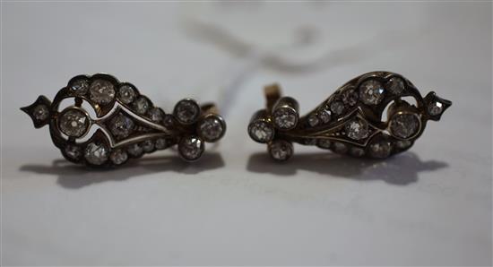 A pair of late 19th century gold, silver and diamond pear shaped earrings, 1in.